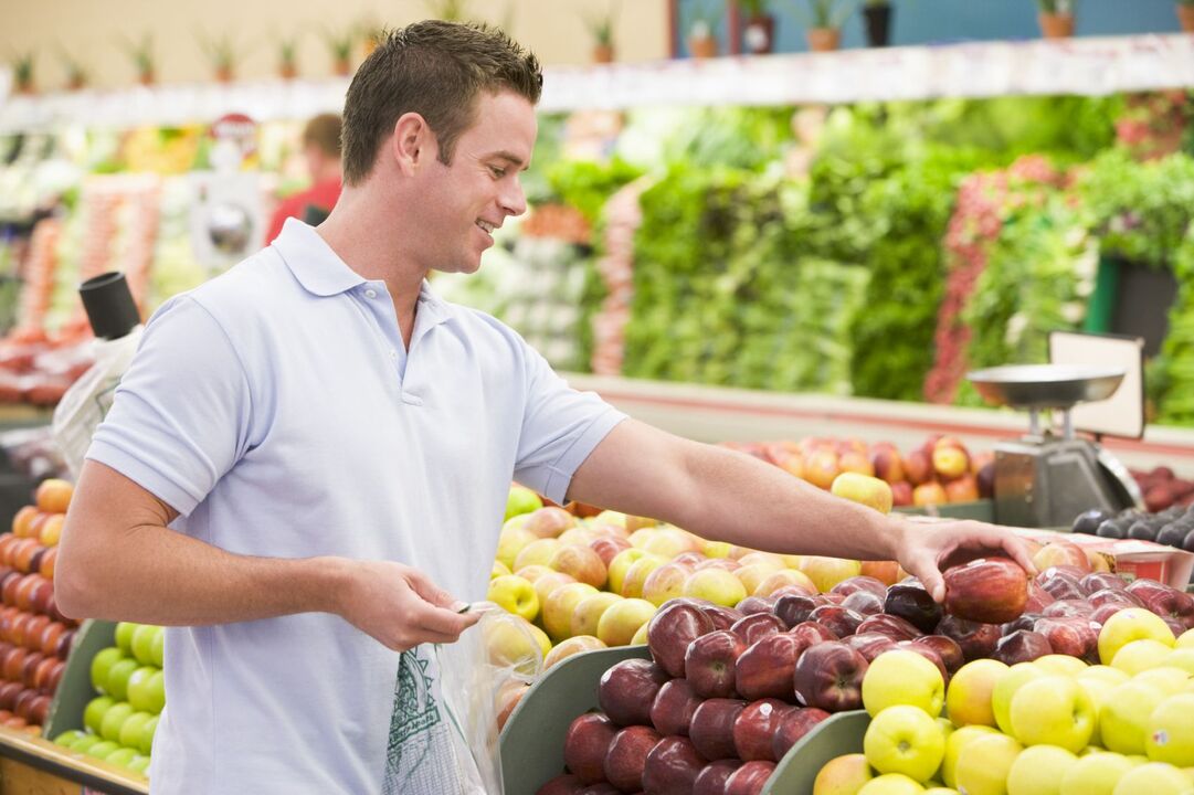 man chooses apples for efficiency